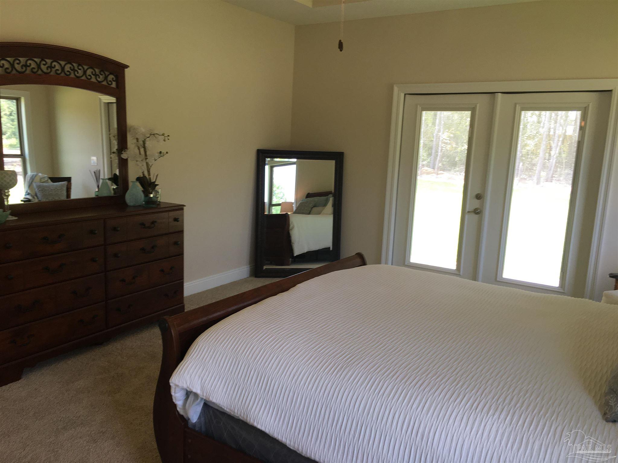 5210 South A Jones Road Milton, FL 32583 - Photo 32 of 37 Master bedroom has a private exit/entry to patio.