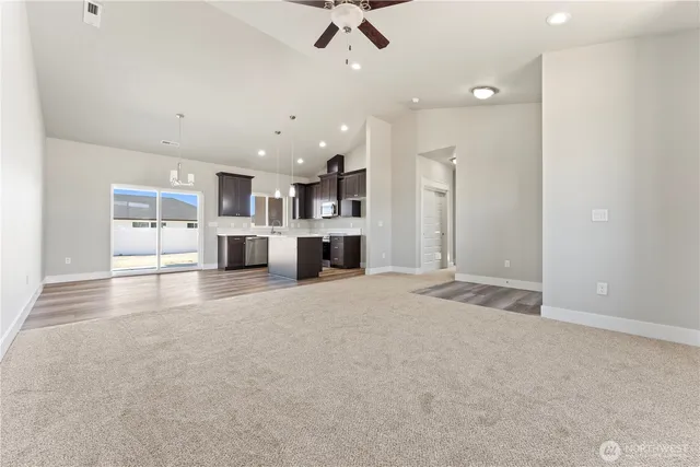 a view of a kitchen with a sink and a window
