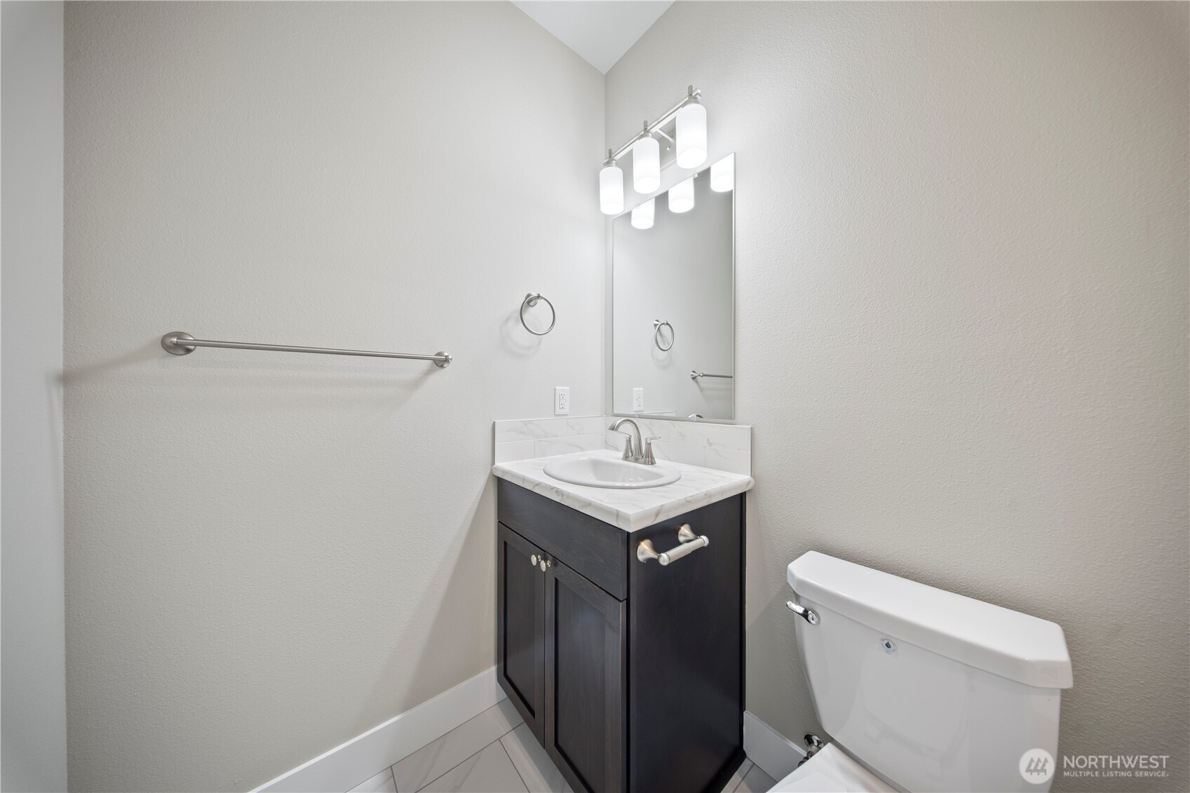 713 O Street Southwest Quincy, WA 98848 - Photo 25 of 34 a bathroom with a sink a toilet and a mirror