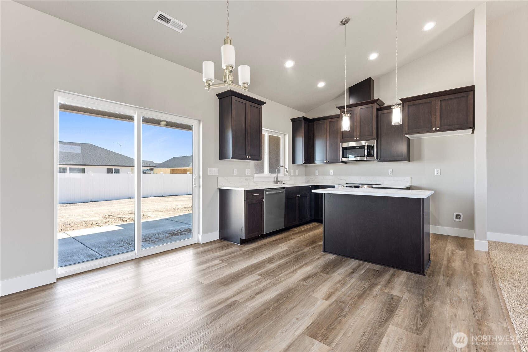 713 O Street Southwest Quincy, WA 98848 - Photo 6 of 34 a kitchen with kitchen island a sink stainless steel appliances and cabinets