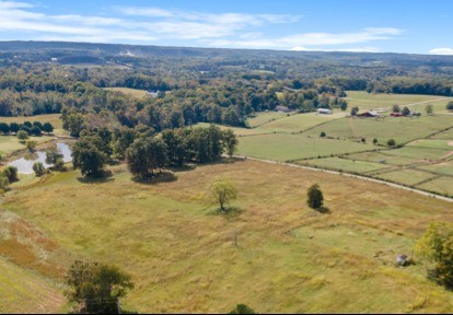 7303 Doug Hill Road Bon Aqua, TN 37025 - Photo 3 of 8 a view of a beach with a mountain