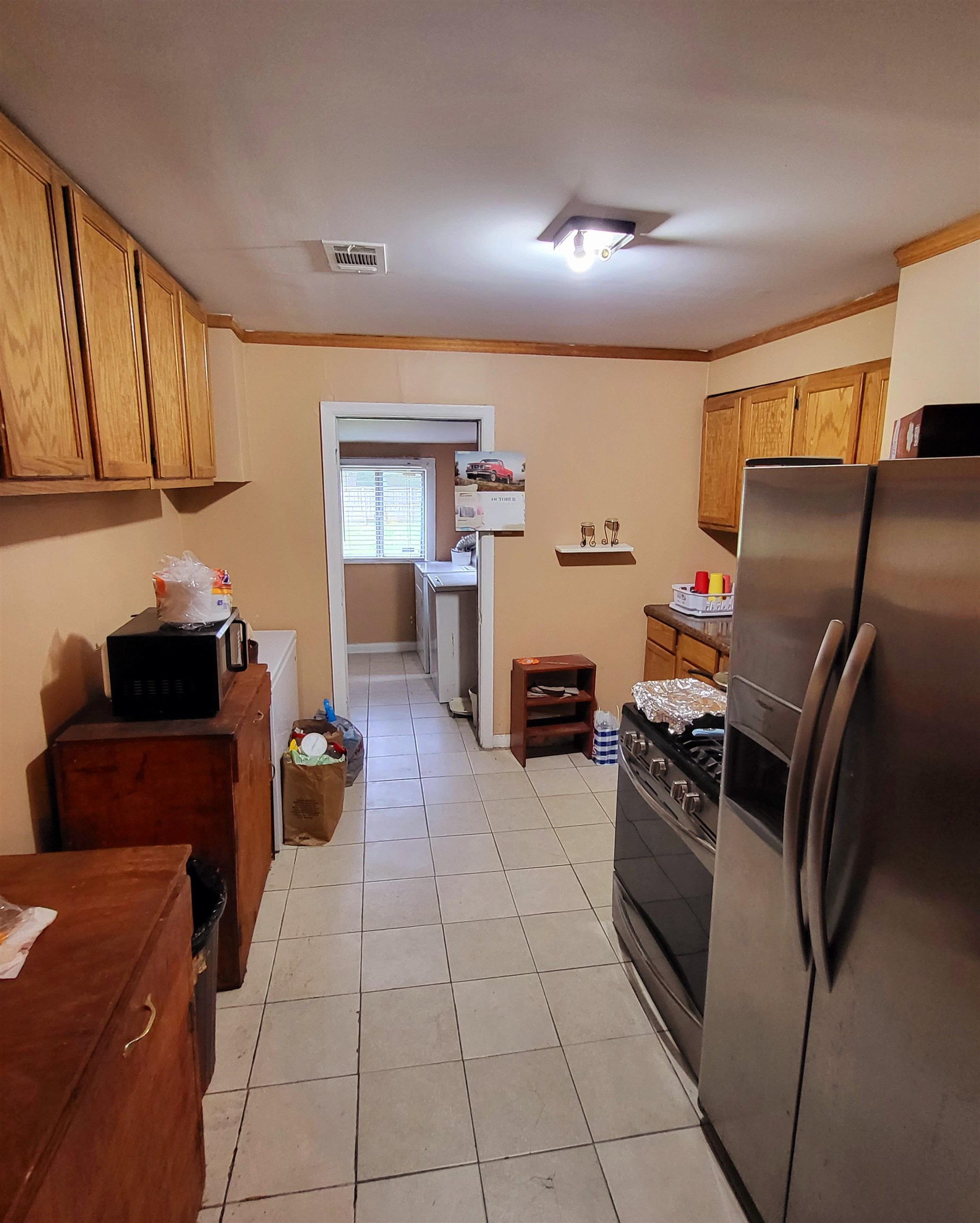 3480 Old Getwell Road Memphis, TN 38118 - Photo 16 of 20 a kitchen with stainless steel appliances granite countertop a refrigerator and a stove