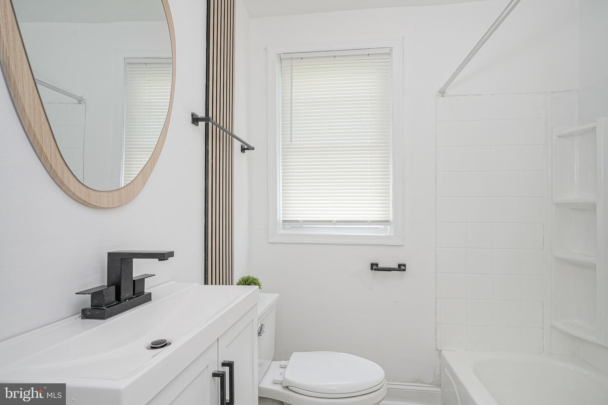 133 Lemmon Avenue Pemberton, NJ 08068 - Photo 14 of 25 a bathroom with a sink a toilet and shower