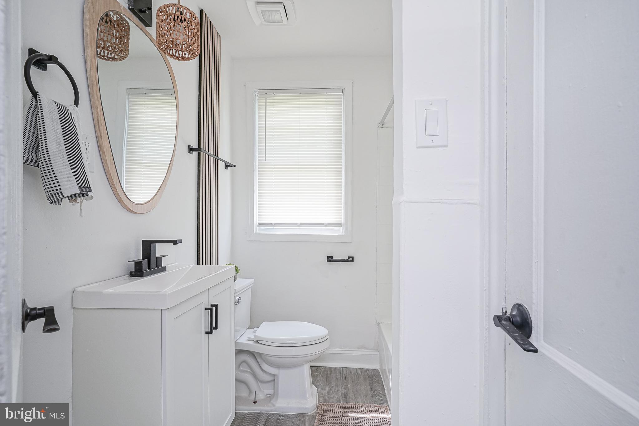 133 Lemmon Avenue Pemberton, NJ 08068 - Photo 15 of 25 a bathroom with a toilet sink and mirror