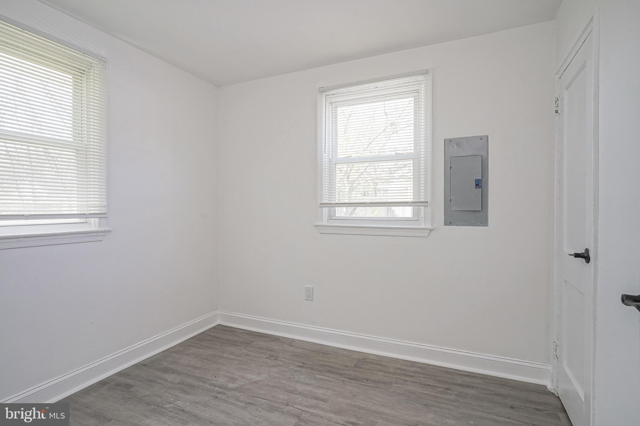 133 Lemmon Avenue Pemberton, NJ 08068 - Photo 20 of 25 an empty room with wooden floor and windows