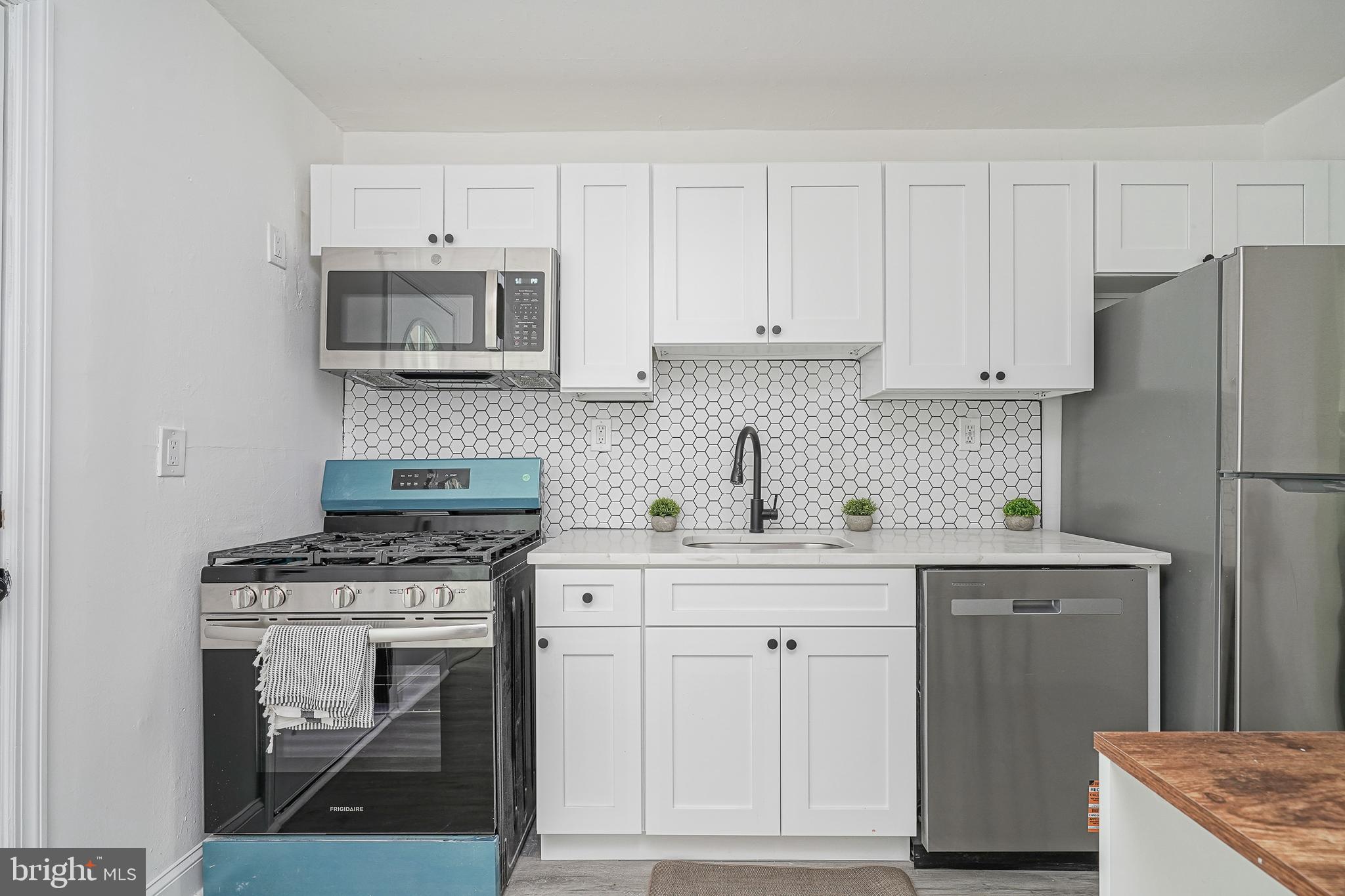 133 Lemmon Avenue Pemberton, NJ 08068 - Photo 9 of 25 a kitchen with cabinets stainless steel appliances and sink