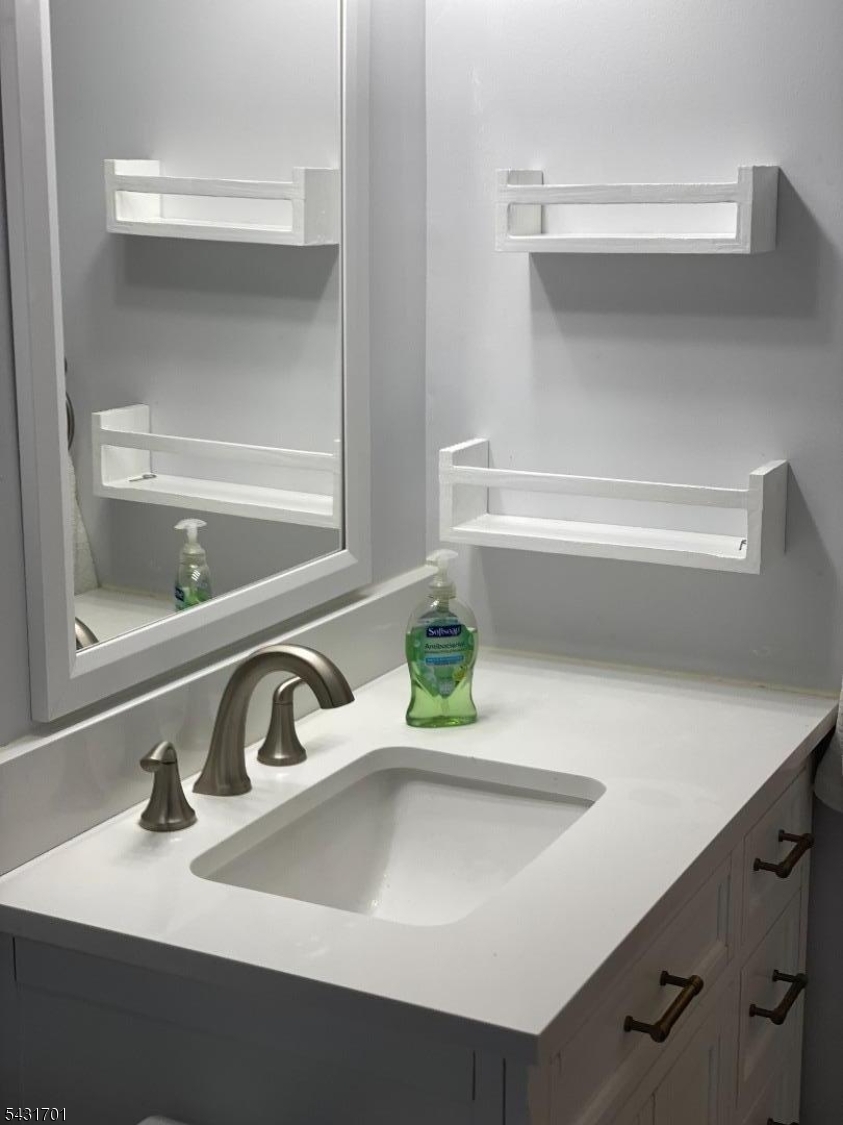 161 Evergreen Road, Unit 13A Edison, NJ 08837 - Photo 8 of 12 a bathroom with a sink and a window