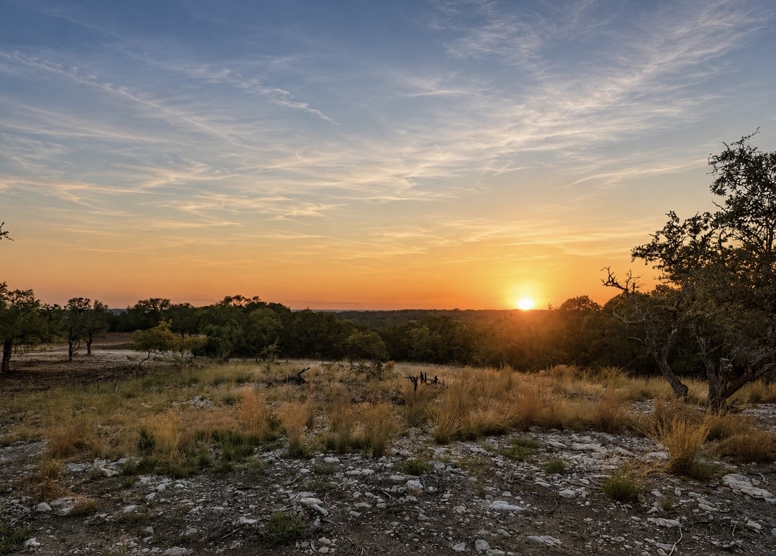 2017 County Road 222 Kempner, TX 76539 - Photo 1 of 16 Expansive natural landscape featuring varied terrain with a sunset backdrop, mature trees, and natural ground cover