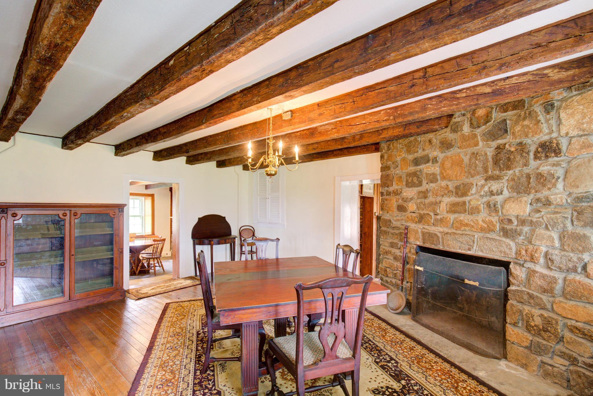 18812 Harmony Church Road Leesburg, VA 20175 - Photo 15 of 30 a dining room with furniture and chandelier
