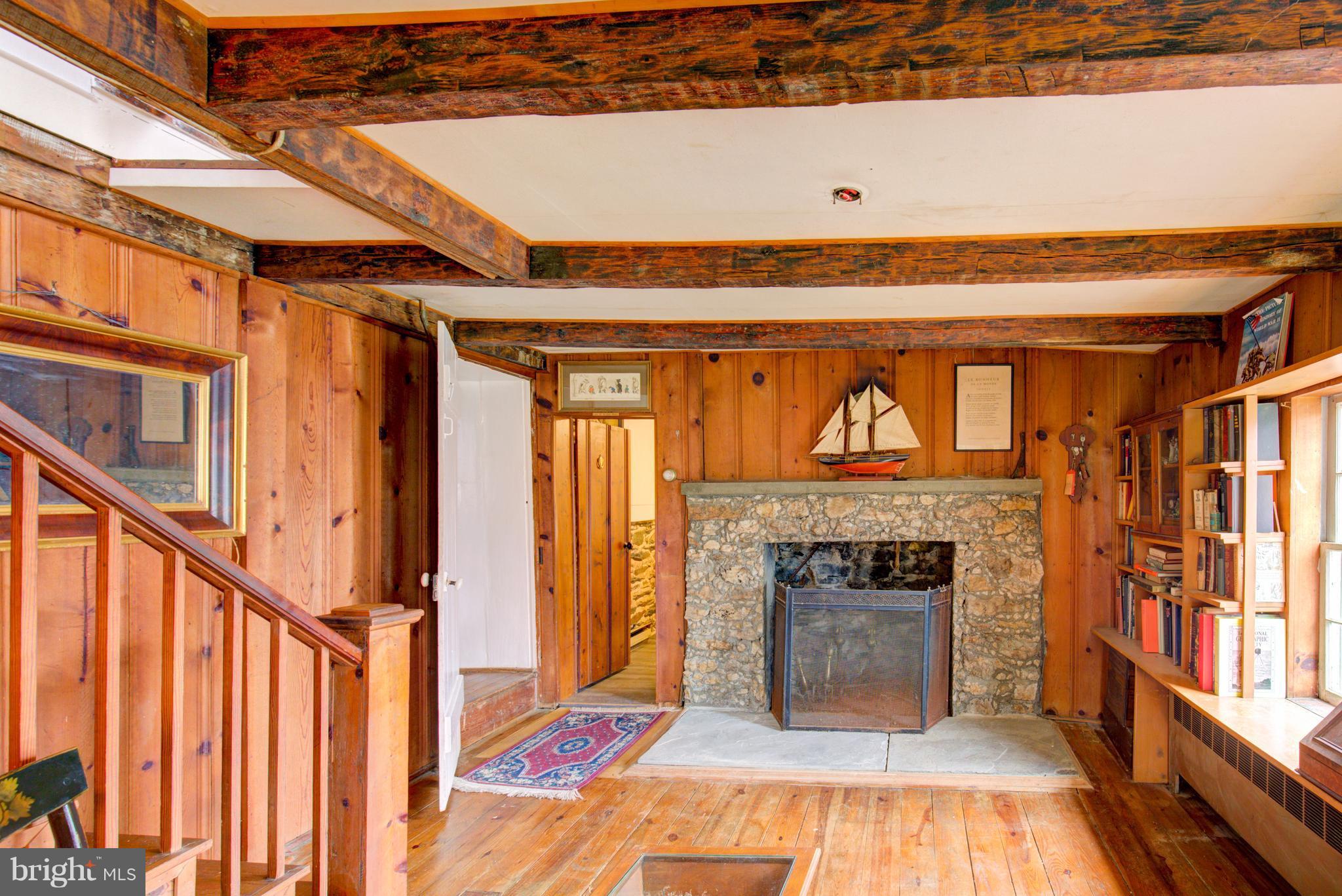 18812 Harmony Church Road Leesburg, VA 20175 - Photo 16 of 30 a living room with a fireplace and a floor to ceiling window