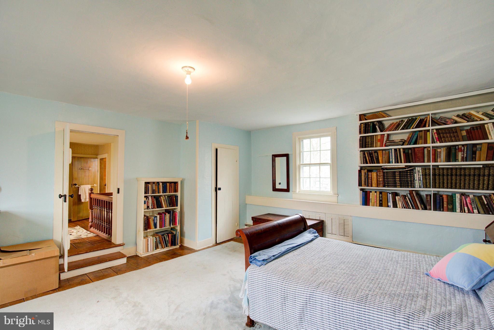 18812 Harmony Church Road Leesburg, VA 20175 - Photo 17 of 30 a bedroom with a bed and a window