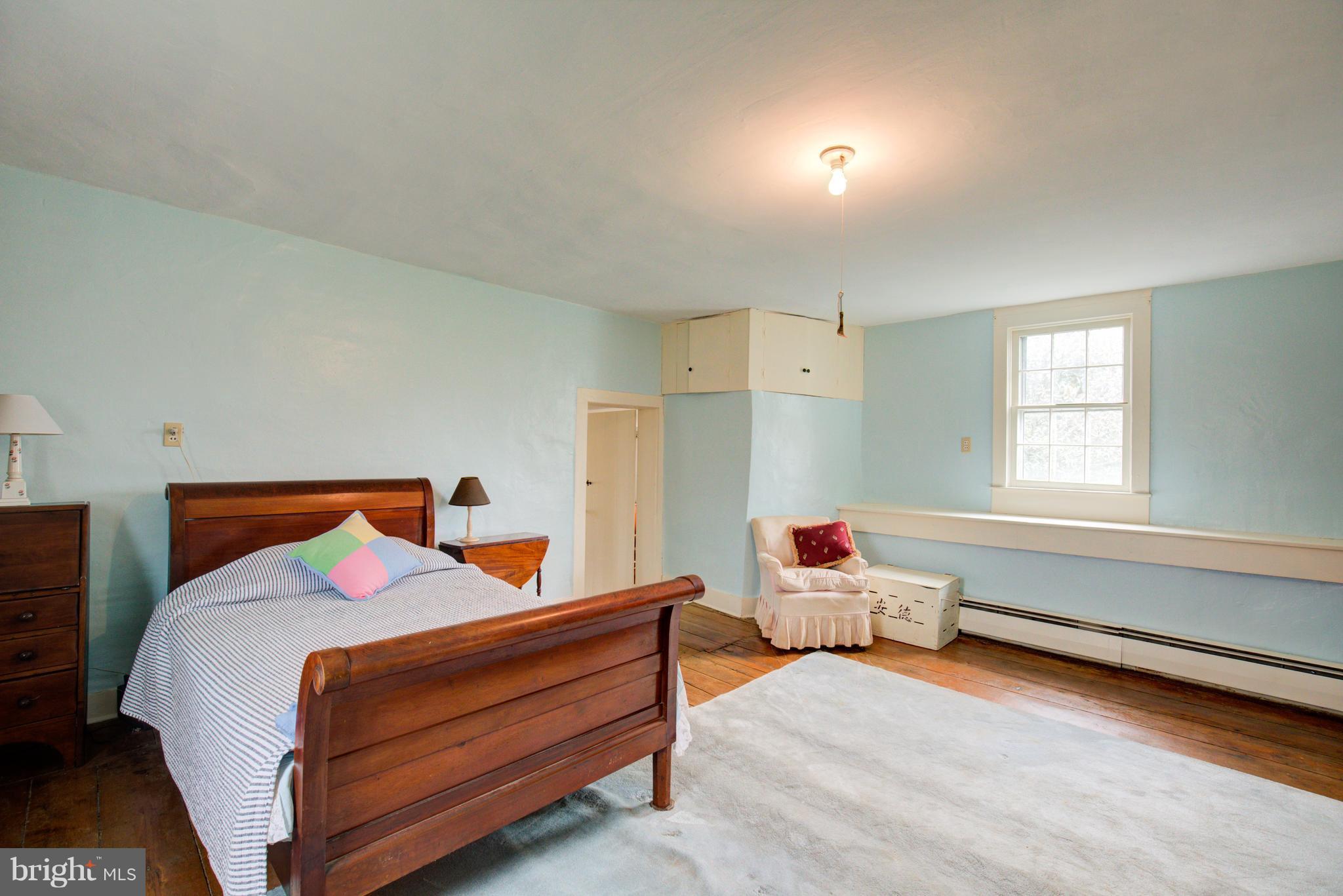 18812 Harmony Church Road Leesburg, VA 20175 - Photo 19 of 30 a bedroom with furniture and a window