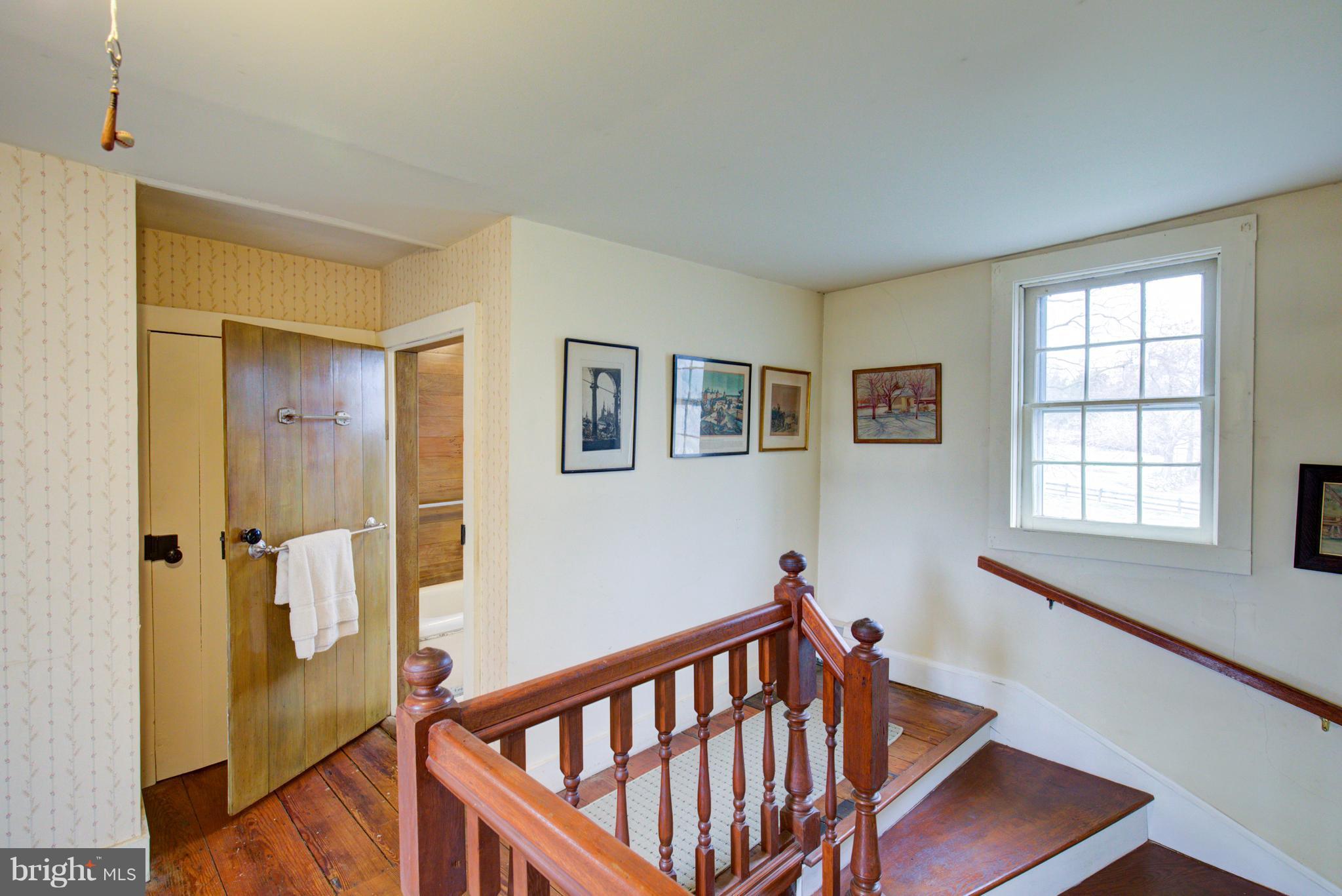 18812 Harmony Church Road Leesburg, VA 20175 - Photo 20 of 30 a view of a hallway with windows and stairs