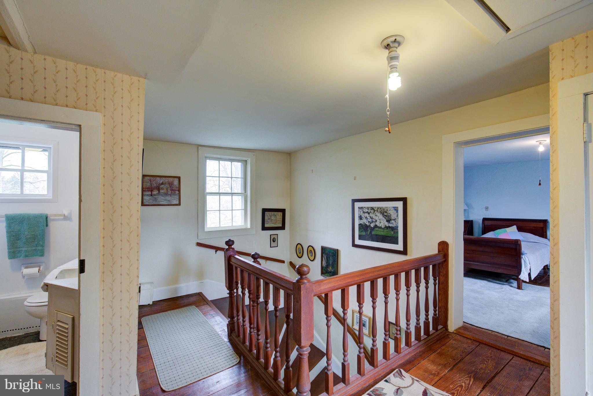 18812 Harmony Church Road Leesburg, VA 20175 - Photo 22 of 30 a view of a hallway with furniture and windows