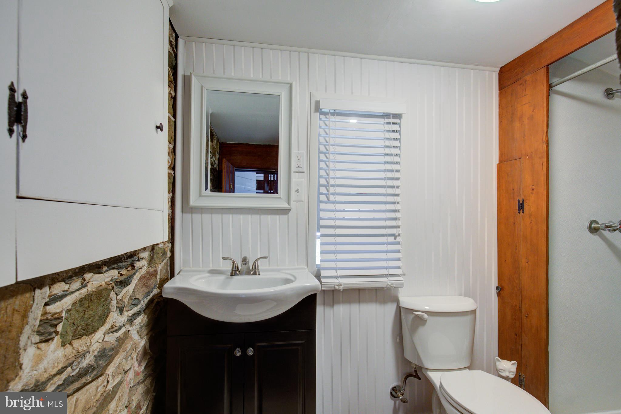 18812 Harmony Church Road Leesburg, VA 20175 - Photo 23 of 30 a bathroom with a sink toilet and mirror