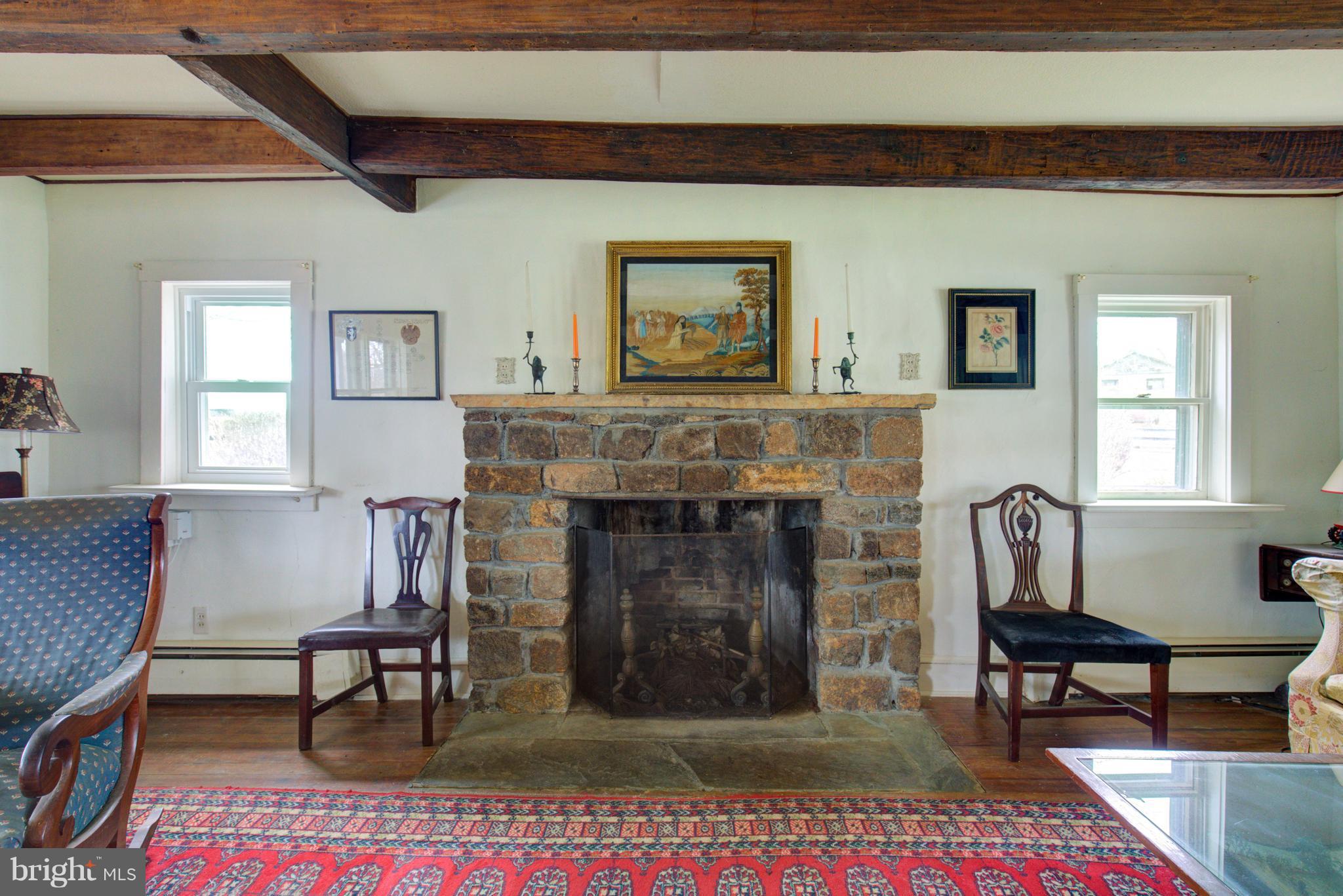 18812 Harmony Church Road Leesburg, VA 20175 - Photo 26 of 30 a living room with furniture and a fireplace