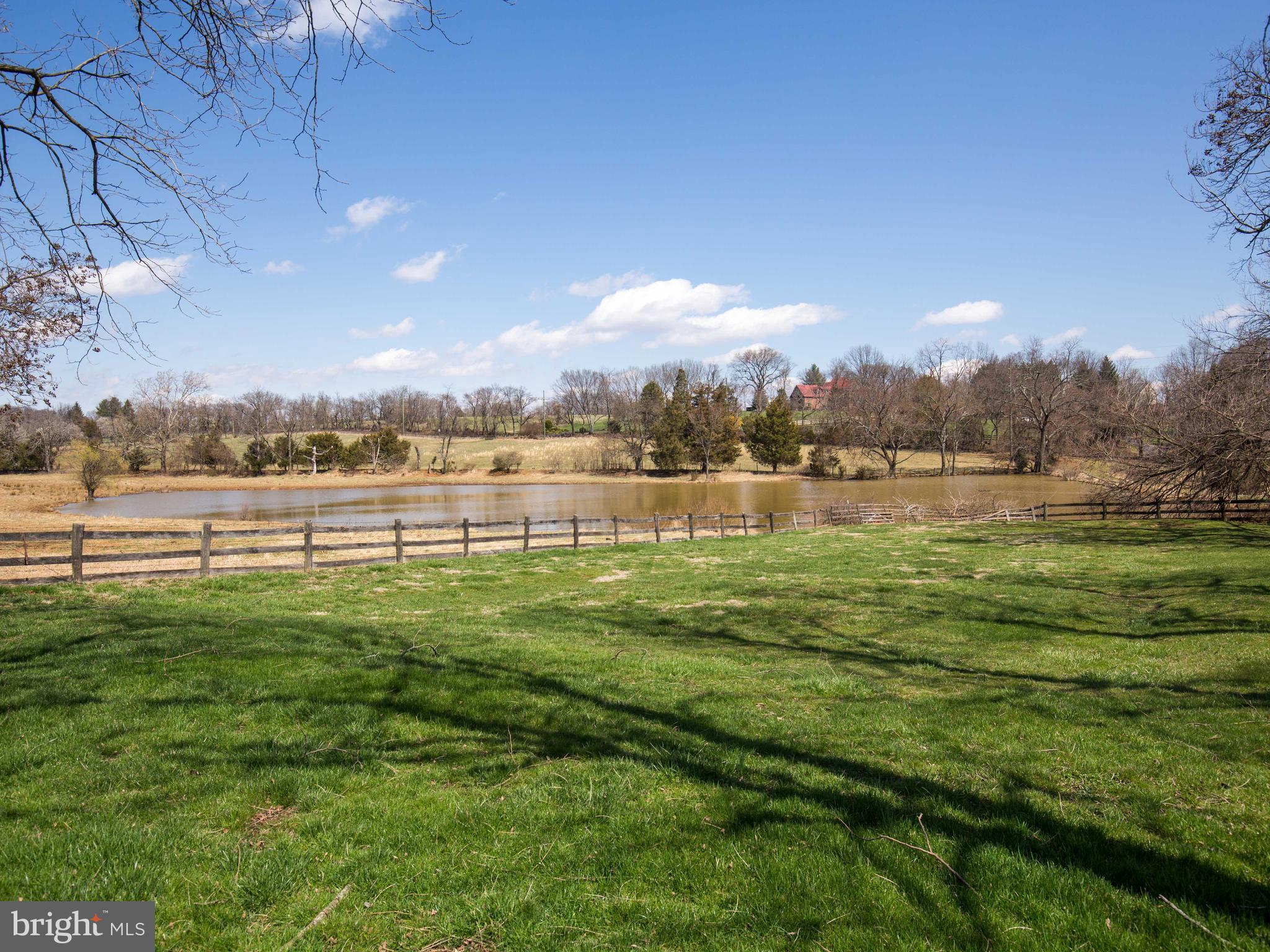 18812 Harmony Church Road Leesburg, VA 20175 - Photo 6 of 30 a view of a lake with houses in the back