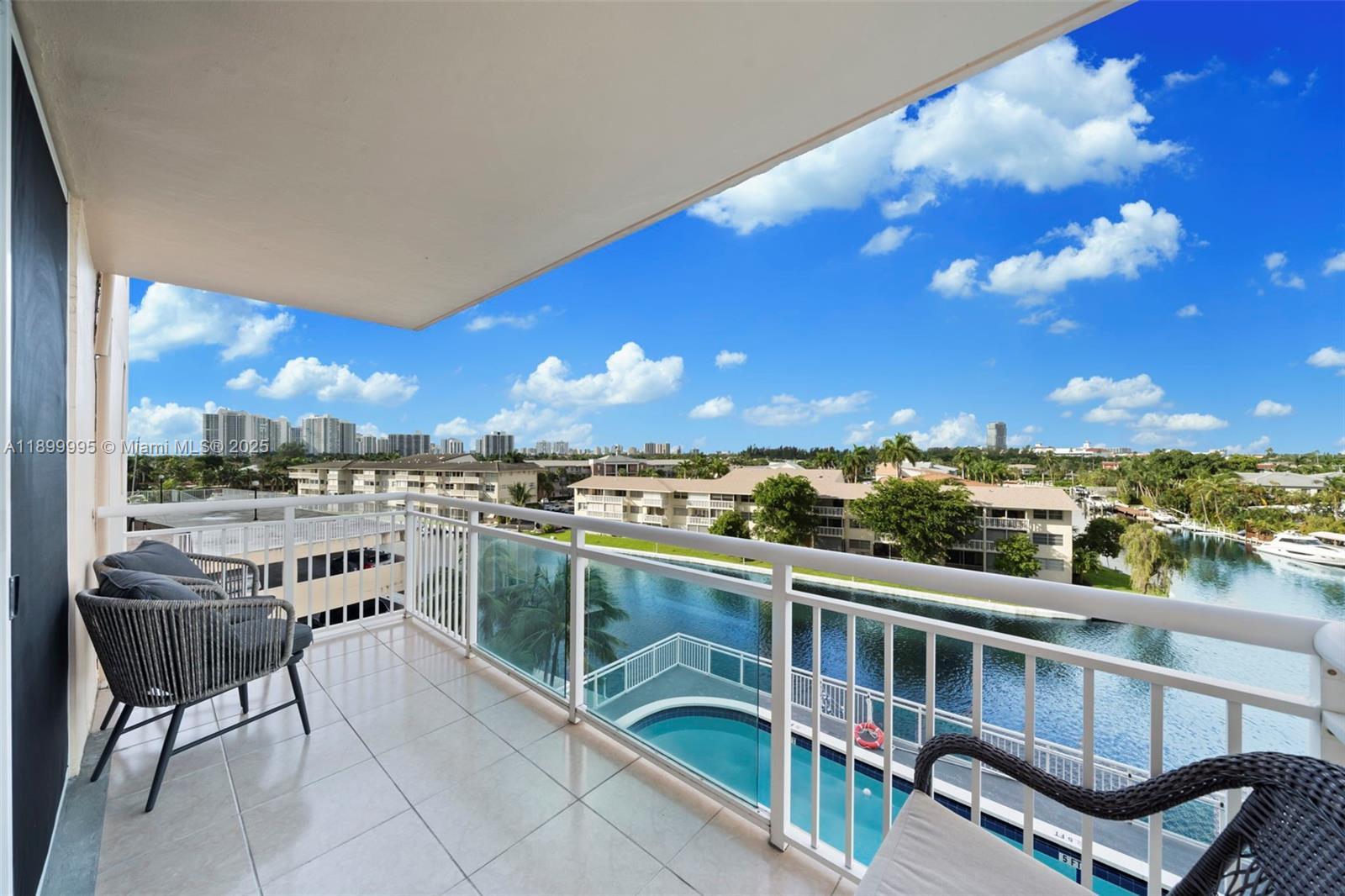 437 Golden Isles Drive, Unit 5J Hallandale Beach, FL 33009 - Photo 21 of 34 a view of a balcony with a patio