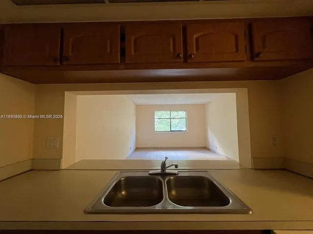 a bathroom with a sink and cabinets