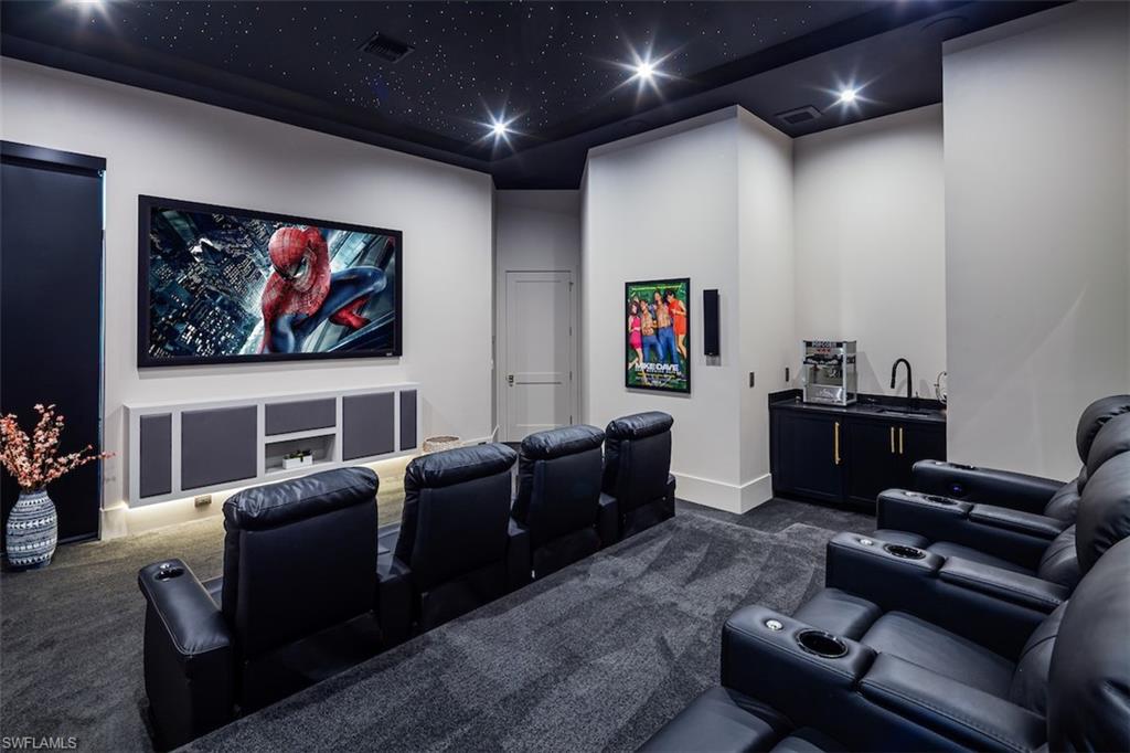728 Carica Road Naples, FL 34108 - Photo 11 of 26 a living room with furniture and a flat screen tv