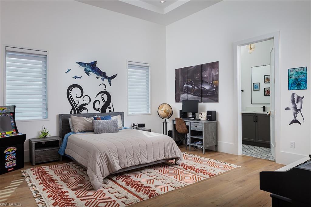 728 Carica Road Naples, FL 34108 - Photo 15 of 26 a bedroom with double bed and a window