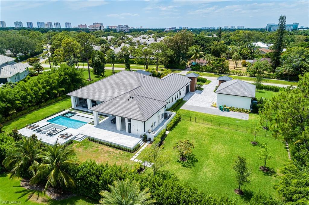 728 Carica Road Naples, FL 34108 - Photo 21 of 26 an aerial view of a house with a garden