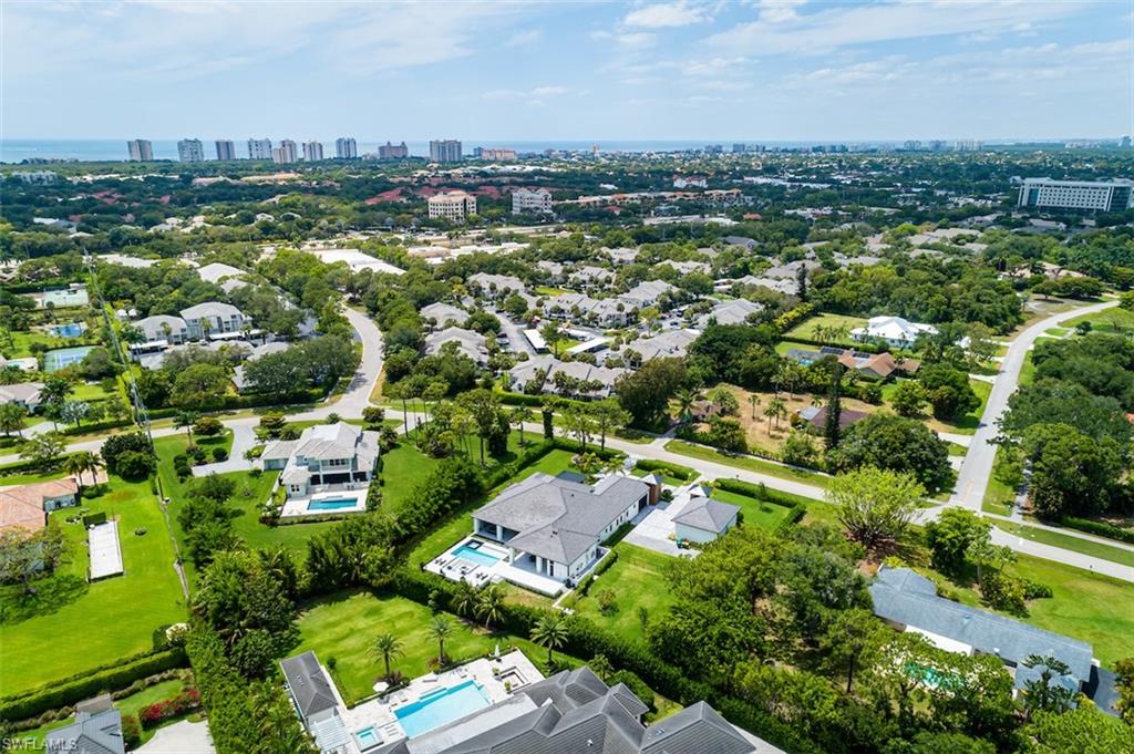 728 Carica Road Naples, FL 34108 - Photo 23 of 26 an aerial view of residential houses with outdoor space