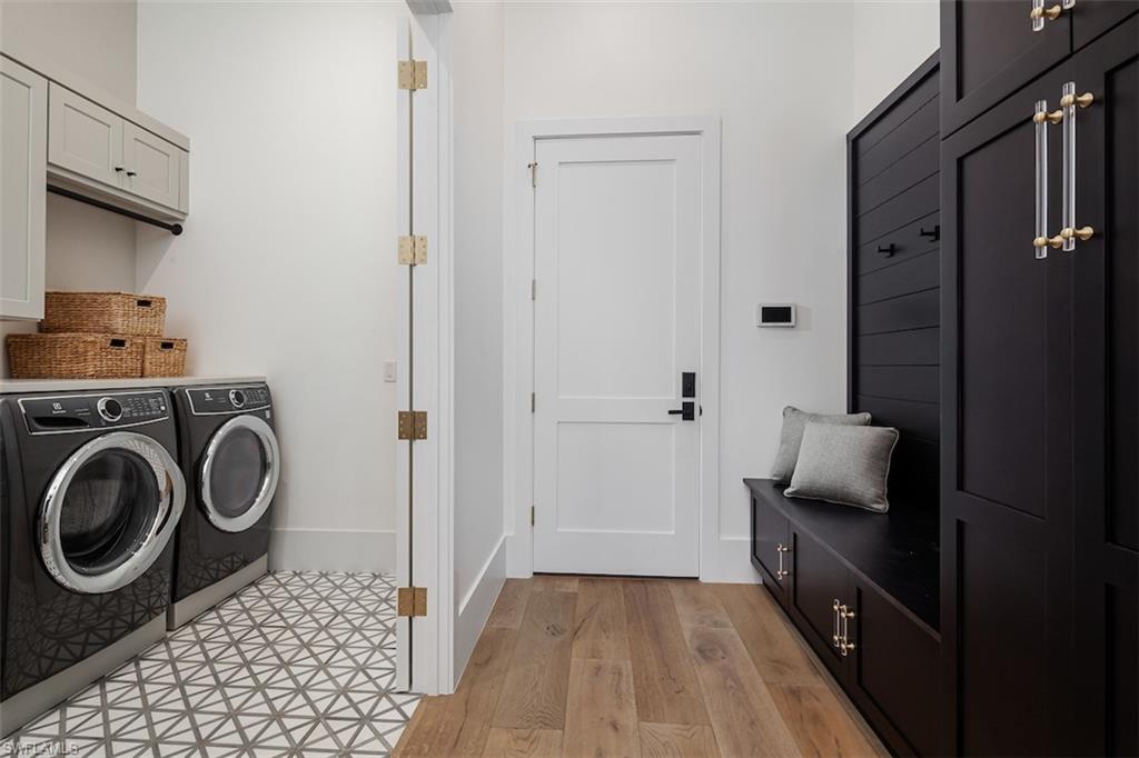 728 Carica Road Naples, FL 34108 - Photo 25 of 26 a view of bathroom with washer and dryer