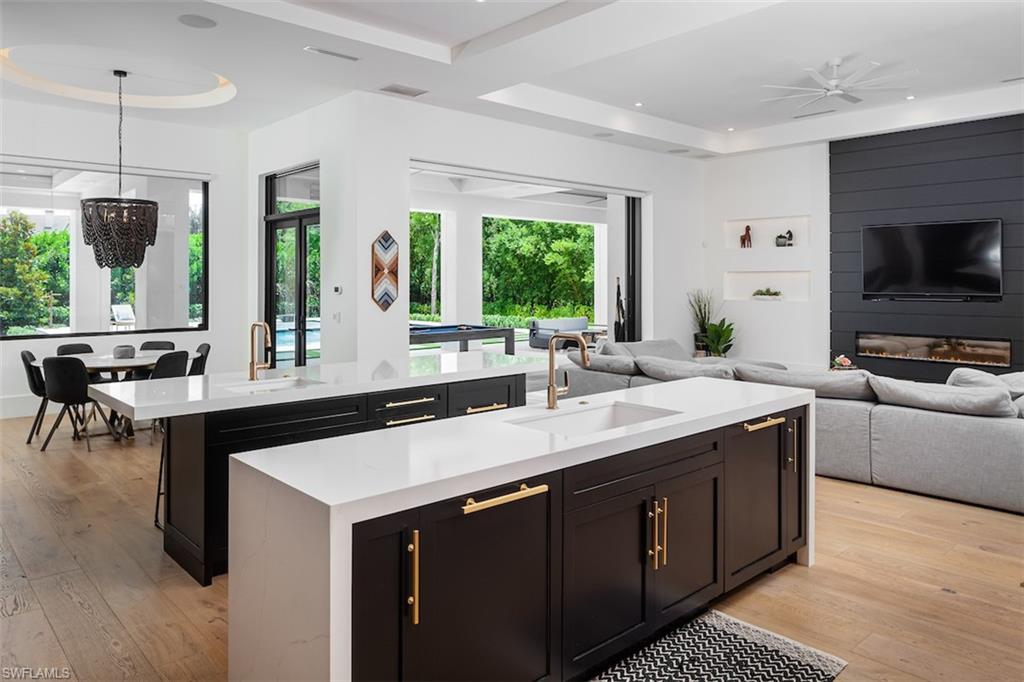 728 Carica Road Naples, FL 34108 - Photo 6 of 26 a kitchen with a sink and large window
