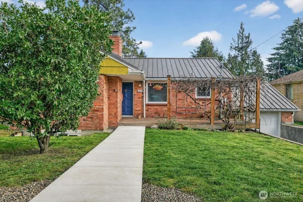 a front view of a house with garden