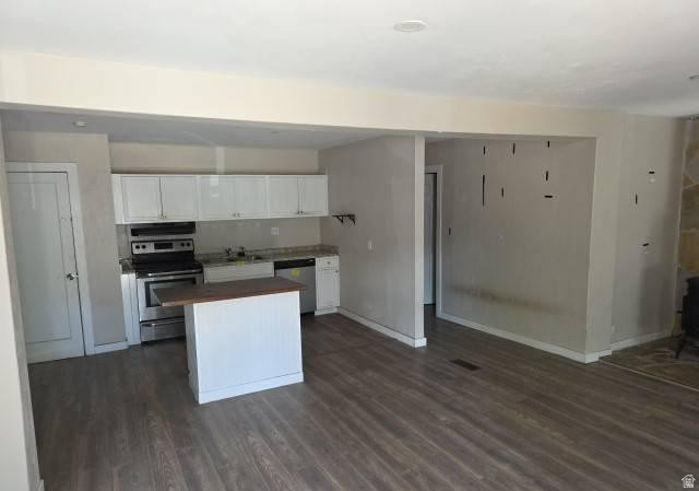 3161 Adams Avenue Ogden, UT 84403 - Photo 3 of 17 Open-concept living space featuring wood-finish flooring throughout