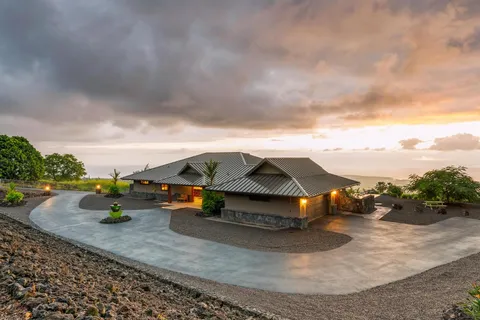 an aerial view of a house with yard