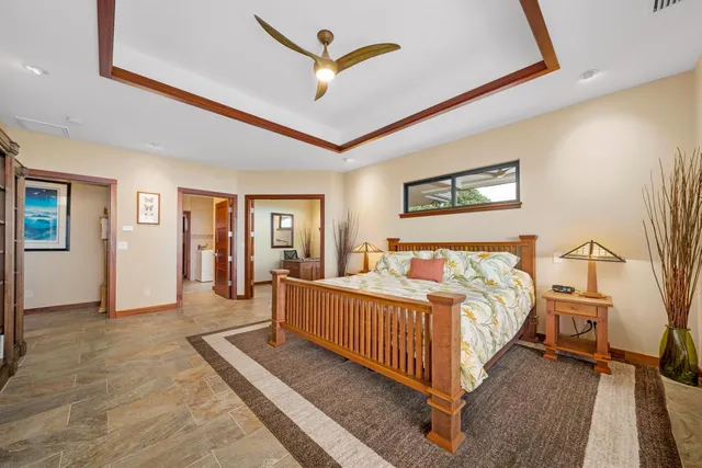 a bed room with a bed and a chandelier