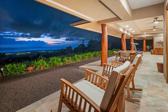 an aerial view of a house with yard