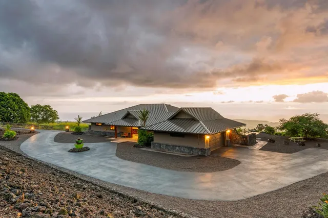 a terrace with outdoor seating and city view