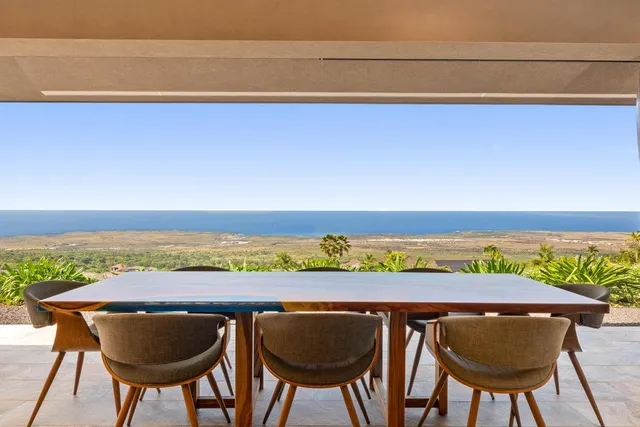 a view of chairs and table in the ocean