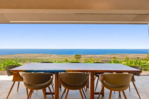 a view of chairs and table in a patio