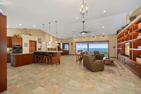 a large living room with chairs