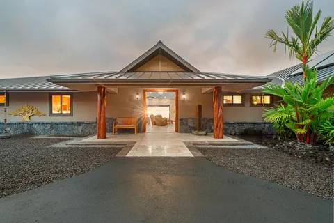 a view of a house with a yard and garage