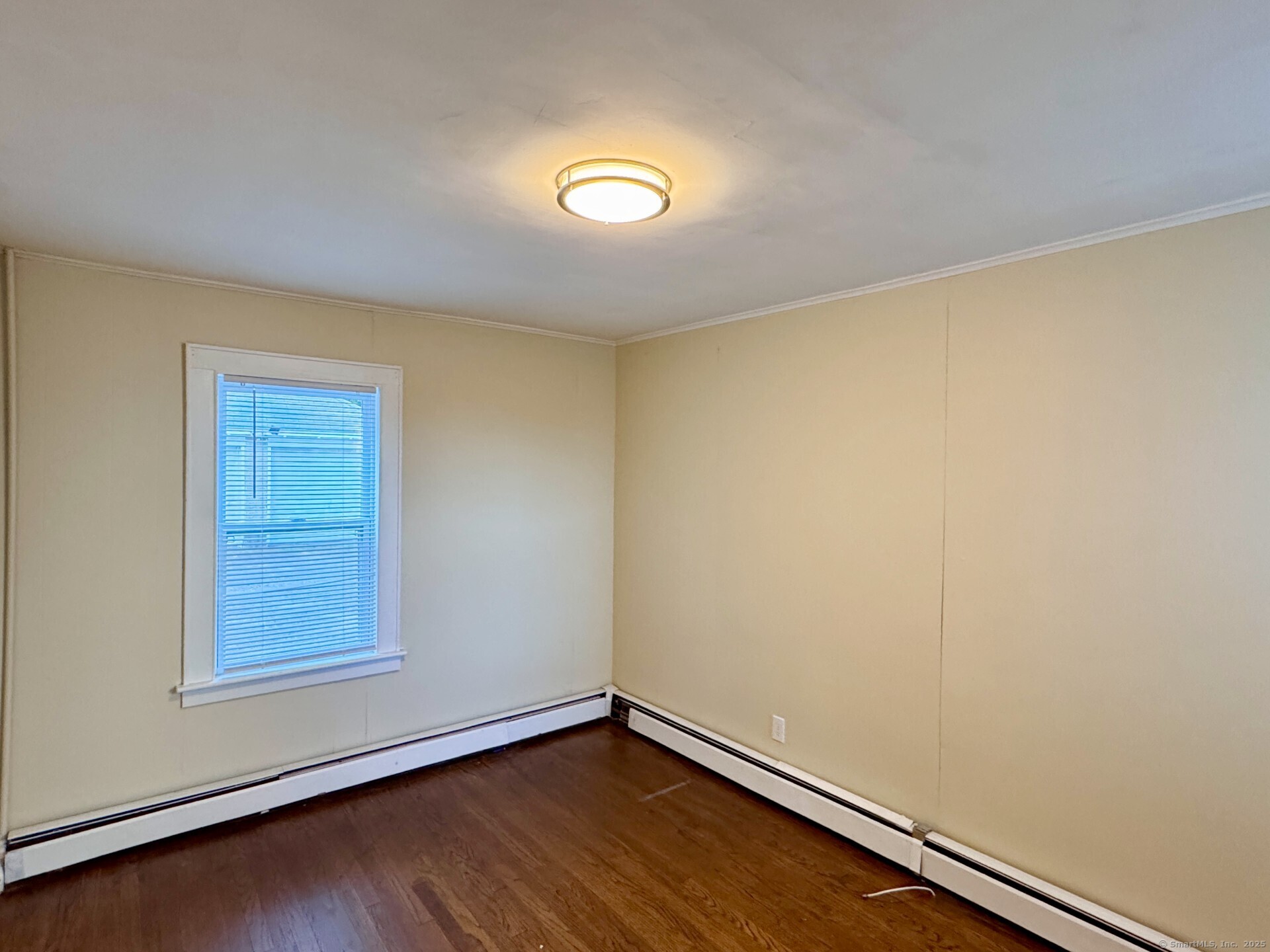 132 North Elm Street, Unit U1 Torrington, CT 06790 - Photo 11 of 12 an empty room with a bench