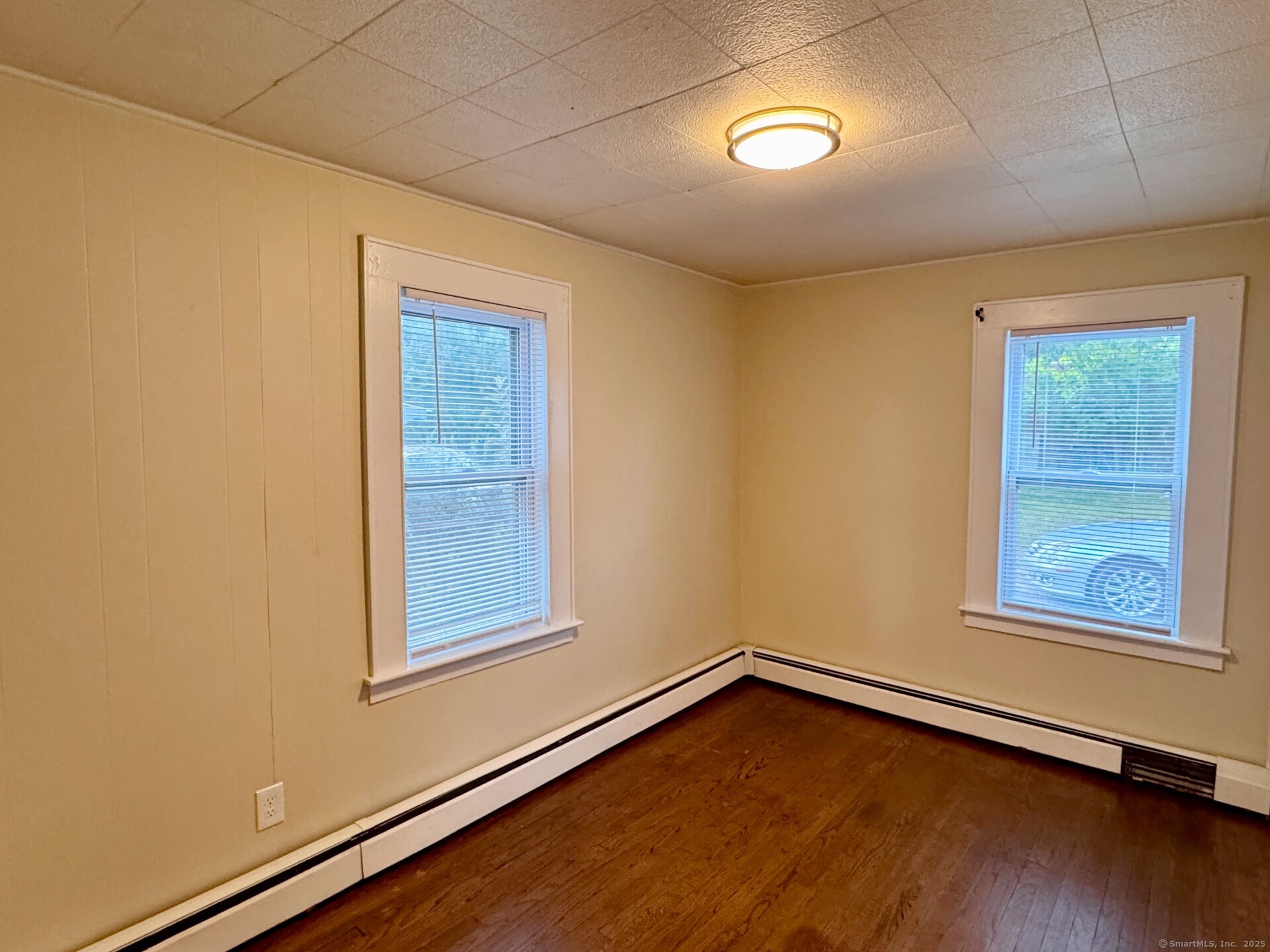132 North Elm Street, Unit U1 Torrington, CT 06790 - Photo 10 of 12 an empty room with windows
