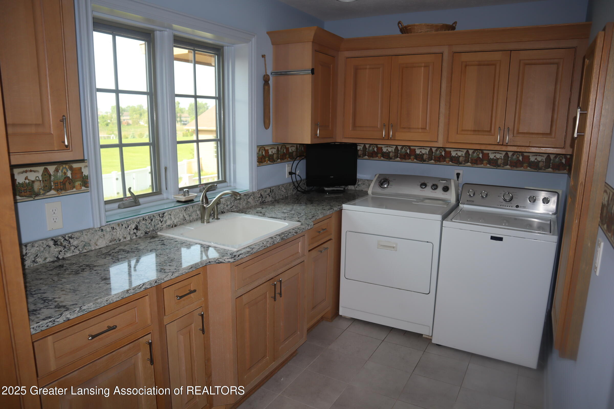 5565 Holt Road Holt, MI 48842 - Photo 23 of 36 large laundry room
