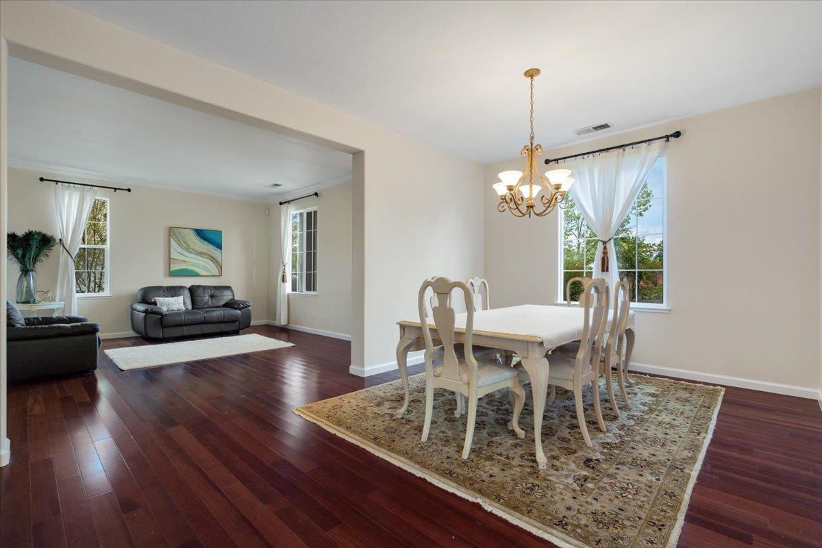 9145 Desiderio Way Gilroy, CA 95020 - Photo 11 of 33 a view of a dining room with furniture window and wooden floor