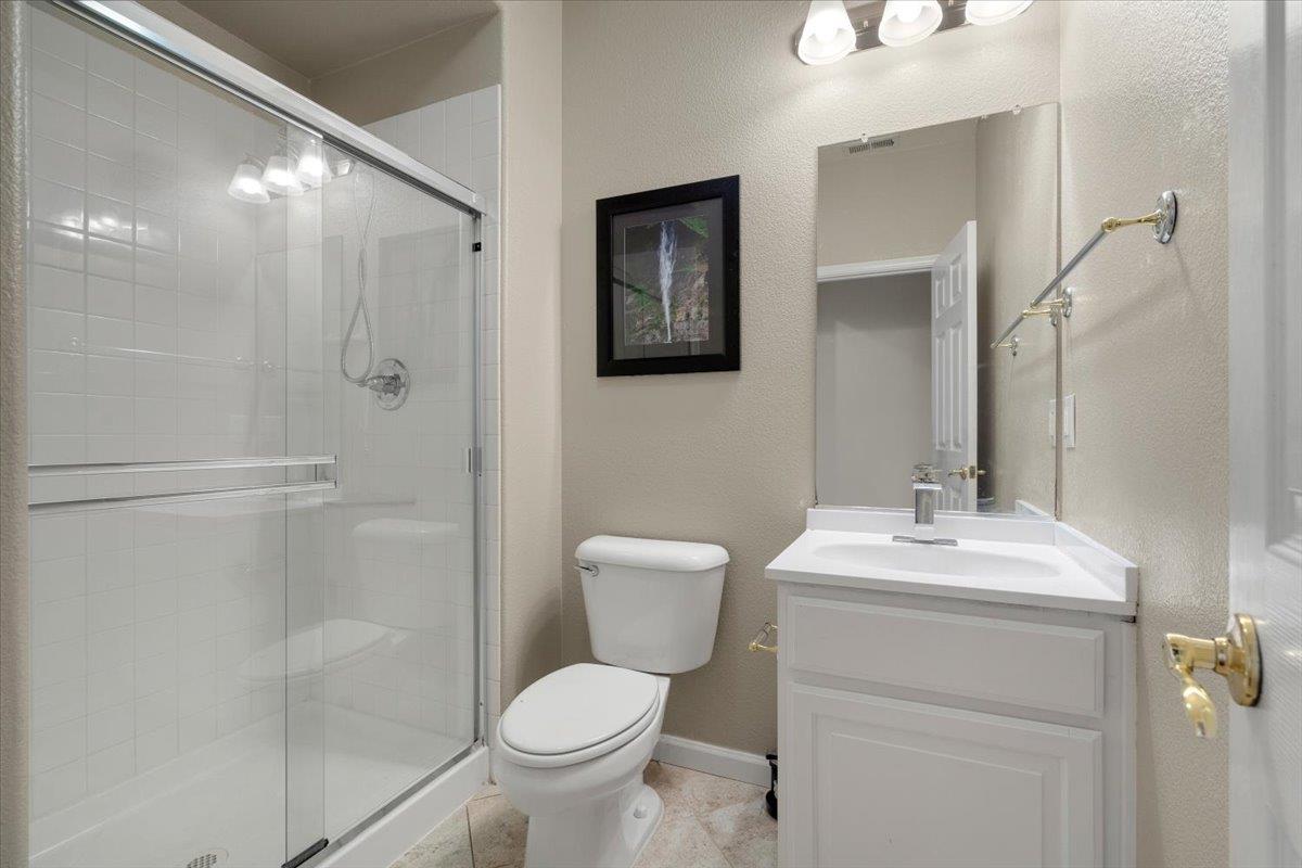 9145 Desiderio Way Gilroy, CA 95020 - Photo 15 of 33 a bathroom with a toilet sink and shower