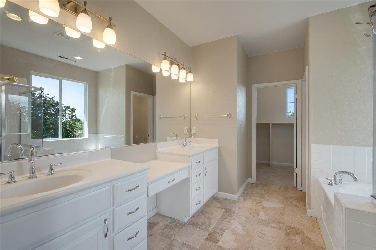 9145 Desiderio Way Gilroy, CA 95020 - Photo 16 of 33 a spacious bathroom with a double vanity sink mirror and double