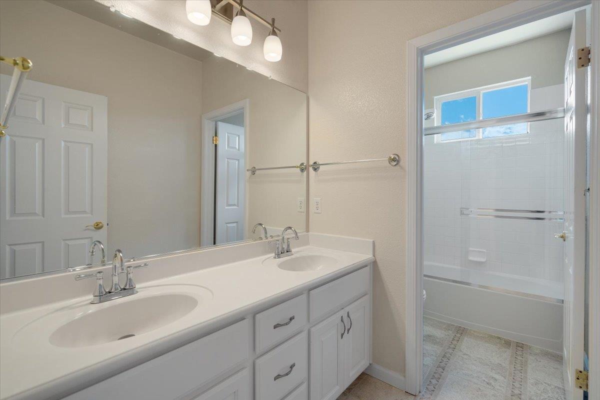 9145 Desiderio Way Gilroy, CA 95020 - Photo 18 of 33 a bathroom with a double vanity sink mirror and double