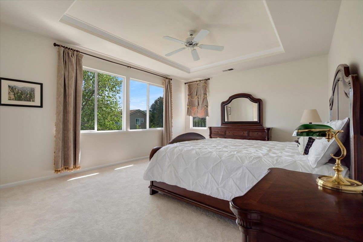9145 Desiderio Way Gilroy, CA 95020 - Photo 20 of 33 a bedroom with a bed wooden floor and window