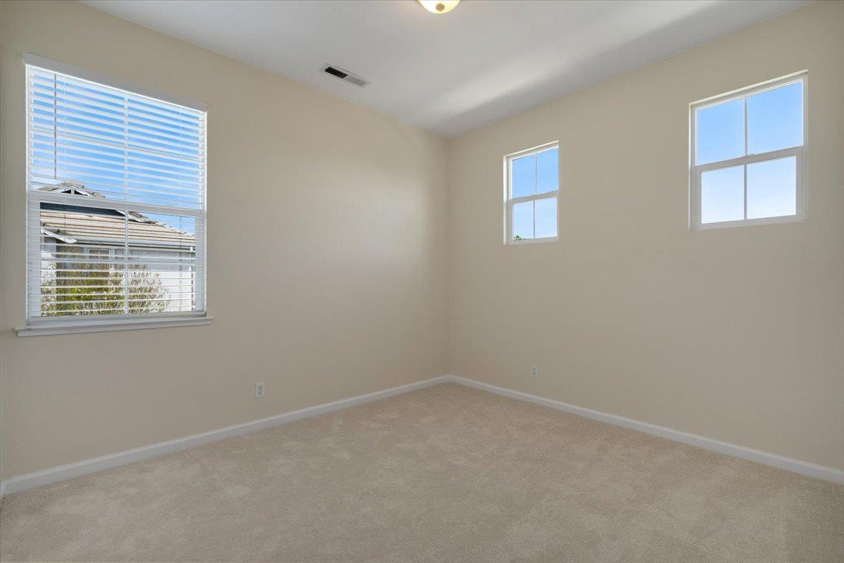 9145 Desiderio Way Gilroy, CA 95020 - Photo 25 of 33 an empty room with windows