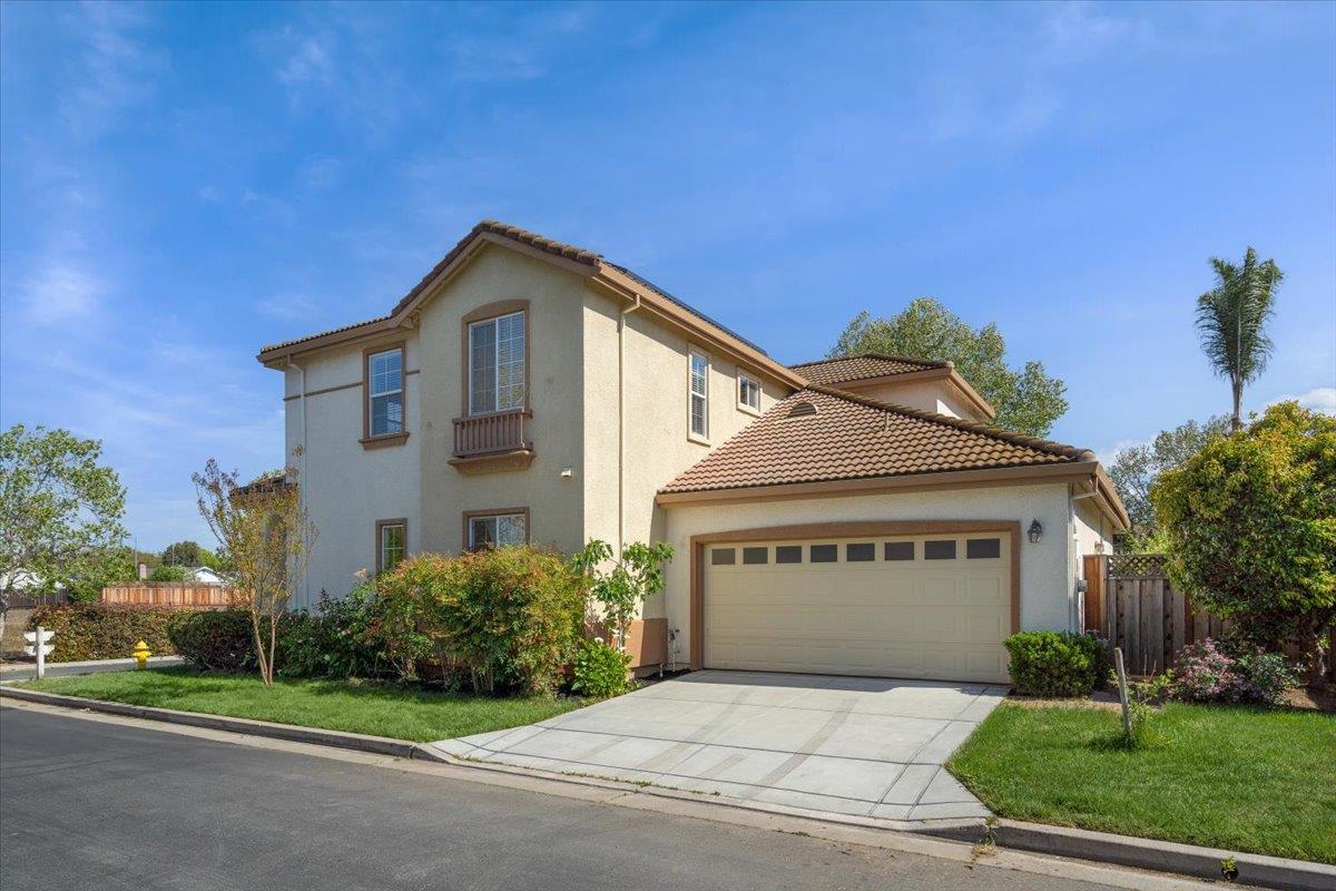 9145 Desiderio Way Gilroy, CA 95020 - Photo 4 of 33 a view of a house with a yard and large tree