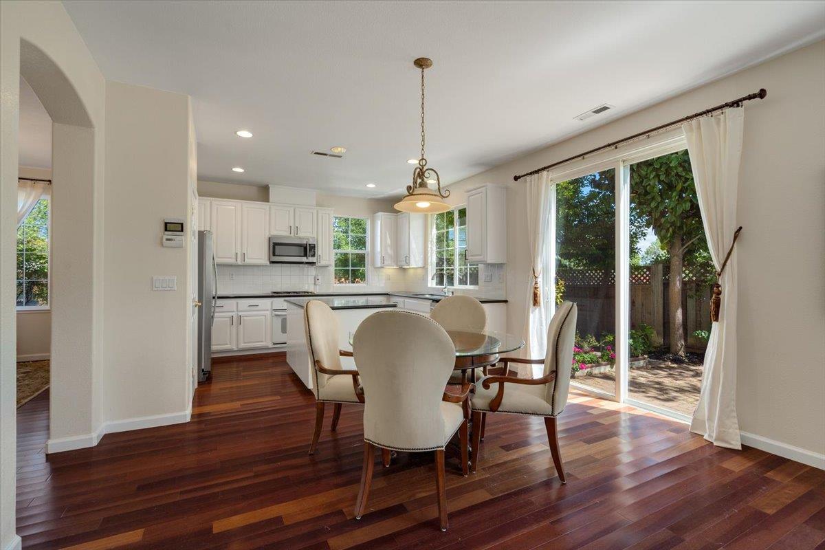 9145 Desiderio Way Gilroy, CA 95020 - Photo 10 of 33 a dining room with furniture window wooden floor